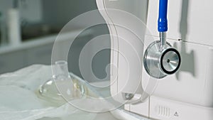 Medicine concept. Close-up of stethoscope, phonendoscope on artificial lung ventilation device. Surgical operation being