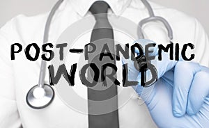 Medicine concept. Doctor writes the word post pandemic world . Image of a hand holding a marker isolated on a white background