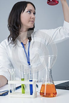 Medicine Concepts and Ideas. Female Laboratory Staff Working with Flasks and Liquids