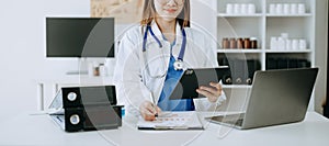 Medicine doctor hand working with modern digital tablet computer interface as medical network concept in office