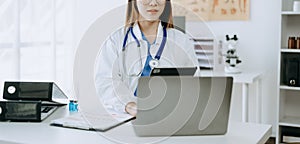 Medicine doctor hand working with modern digital tablet computer interface as medical network concept in office