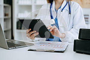 Medicine doctor hand working with modern digital tablet computer interface as medical network concept in office