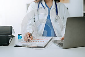 Medicine doctor hand working with modern digital tablet computer interface as medical network concept in office