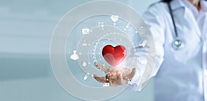 Medicine doctor holding red heart shape with medical icon network photo