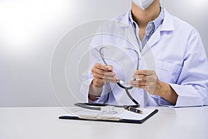 Medicine doctor Holding with stethoscope in hand for nursing care professional and patient trust in hospital`s hospitality concep