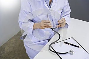 Medicine doctor Holding with stethoscope in hand for nursing care professional and patient trust in hospital`s hospitality concep