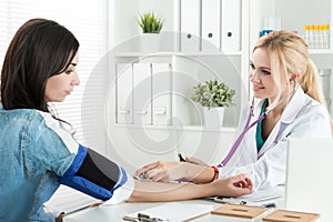 Medicine doctor measuring blood pressure to patient