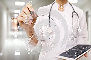 Medicine doctor with modern computer, virtual screen interface and icon medical network connection. health care concept.