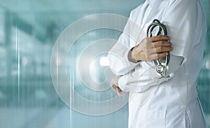 Medicine doctor with stethoscope in hand on hospital background,  Medical technology, Healthcare and Medical concept