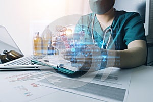 Medicine doctor touching on digital healthcare and network connection with modern virtual screen interface icons on the hospital