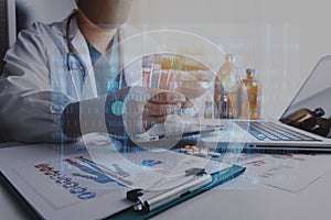 Medicine doctor touching on tablet and digital healthcare and network connection with modern virtual screen interface icons on the