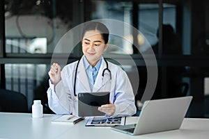 Medicine doctor using digital tablet and smartphone diagnose virtual electronic medical record on interface.Digital healthcare and