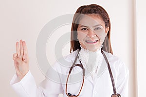 Medicine doctor woman pointing three gesture