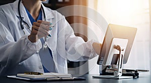 Medicine doctor working with digital medical interface icons on the hospital background, healthcare and Medical technology and