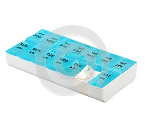 Medicine dose box isolated on white background. Weekly dosage of medication in pill dispenser