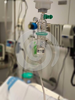 A medicine dropper administrating corticosteroids for an intravenous drip treatment of asthma photo