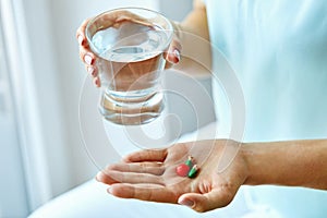 Medicine. Female Hand Holding Vitamins And Pills. Health Care