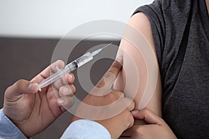 Medicine and health care concept Doctor giving patient vaccine i