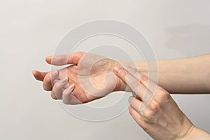 Medicine health care. Female hand checking pulse on wrist