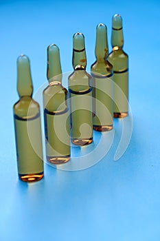 Medicine and health. pharmaceutical ampoules set . Pharmacological serum in ampoules. Copy space. Medical glass brown ampoules set