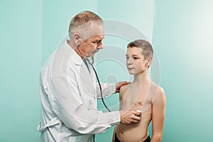 Medicine healthcare and people concept doctor with stethoscope checking patient heart beat, lungs and bronchi