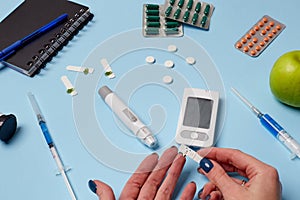 Medicine, healthcare, technology and online pharmacy concept. A diabetic measures your blood glucose