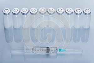 Medicine, Injection, vaccine and disposable syringe, drug concept. Sterile vial medical syringe needle. Glass medical