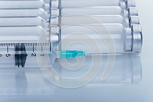 Medicine, Injection, vaccine and disposable syringe, drug concept. Sterile vial medical syringe needle. Glass medical