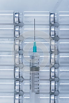 Medicine, Injection, vaccine and disposable syringe, drug concept. Sterile vial medical syringe needle. Glass medical