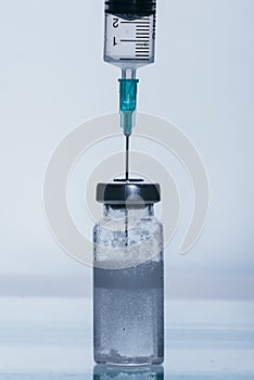 Medicine, Injection, vaccine and disposable syringe, drug concept. Sterile vial medical syringe needle. Glass medical