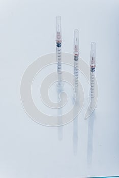 Medicine, Injection, vaccine and disposable syringe isolated, drug concept. Sterile vial medical. Macro close up on