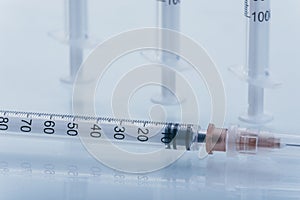 Medicine, Injection, vaccine and disposable syringe isolated, drug concept. Sterile vial medical. Macro close up on