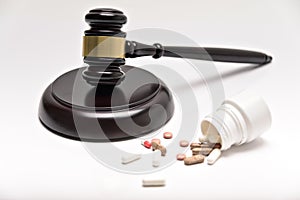 Medicine law concept. Gavel, stethoscope and pills isolated on white.