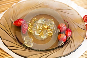 Medicine. Medications and vitamins. Capsules with rosehip oil and dried fruits