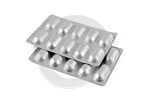 Medicine pills in aluminum foil strip isolated on white background