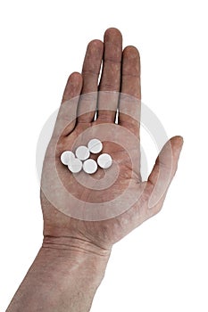 Medicine pills and capsules in hand on white background, Antibiotic, painkiller close up.