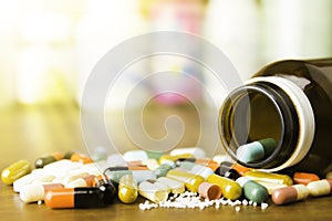 Medicine pills or capsules on wood background.Drug prescription for treatment medication.