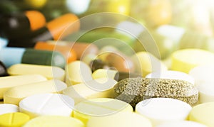 Medicine pills or capsules on wood background.Drug prescription for treatment medication.