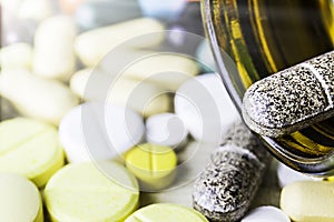 Medicine pills or capsules on wood background.Drug prescription for treatment medication.