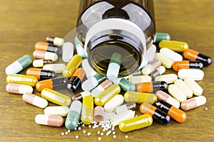 Medicine pills or capsules on wood background.Drug prescription for treatment medication.Pharmaceutical medicament.