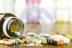 Medicine pills or capsules on wood background.Drug prescription for treatment medication.Pharmaceutical medicament.