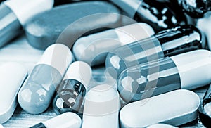 Medicine pills or capsules on wood background.Drug prescription for treatment medication.Pharmaceutical medicament.