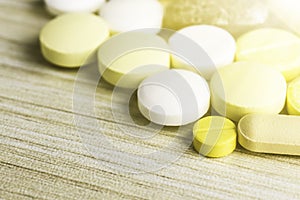 Medicine pills or capsules on wood background.Drug prescription for treatment medication.Pharmaceutical medicament.