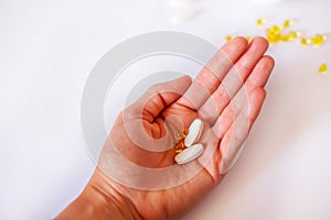 Medicine pills on the hand. Medicine pills. Pills, capsules blisters, glass bottles with liquid medicine & plastic tubes with caps