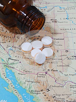 Medicine pills and map for travel