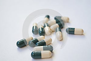 Medicine in pills on white surface