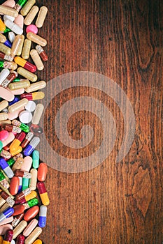 Medicine pills on wood. Health pharmacy concept