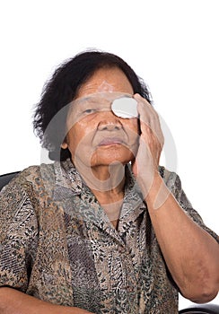 Medicine plaster patch on old woman injury wound eye