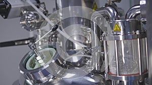 A medicine production machine in a modern laboratory. Pharmaceutical manufacturing equipment. Pharmaceutical