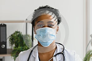 medicine, profession and healthcare concept - african american female doctor or scientist in protective facial mask in